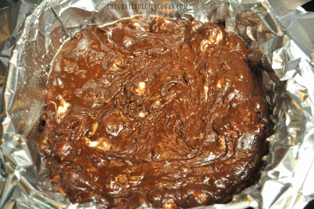 Microwave Rocky Road Fudge is spread in dish and refrigerated for 1 hour.
