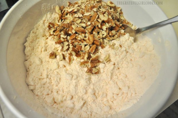 Chopped pecans are added to dry ingredients for cobbler