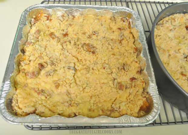 Two pans of Karen's delicious apple cobbler are cooling on wire rack after baking.