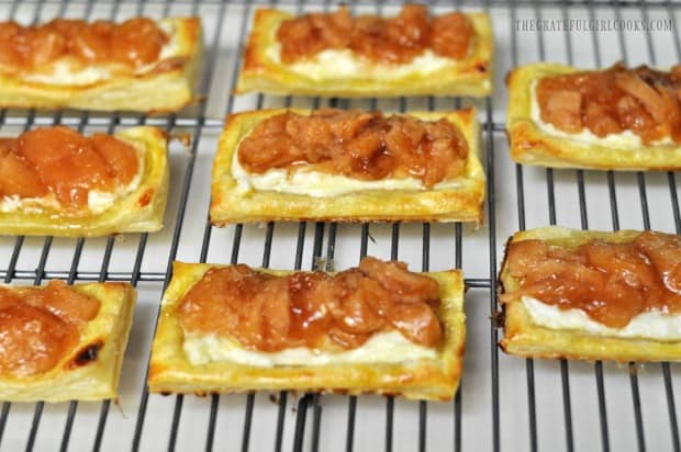 Apple cream cheese pastries are baked, then cool on a wire rack.