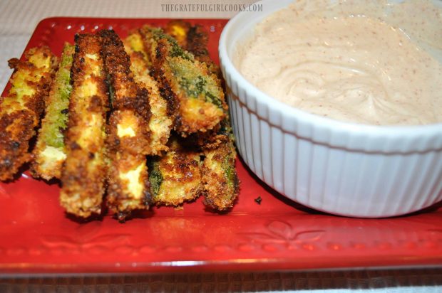 Baked Parmesan Zucchini Fries are served with dipping sauce.