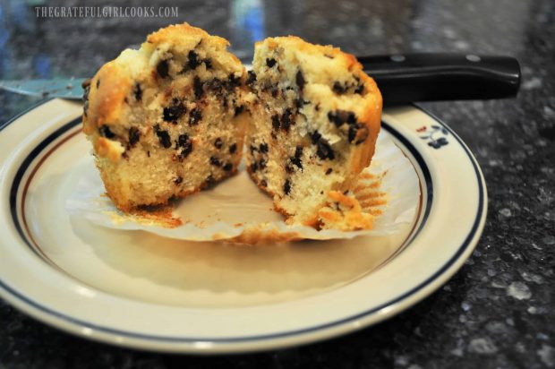 One muffin cut in half on a small plate