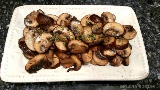 Sautèed mushrooms on a white serving plate