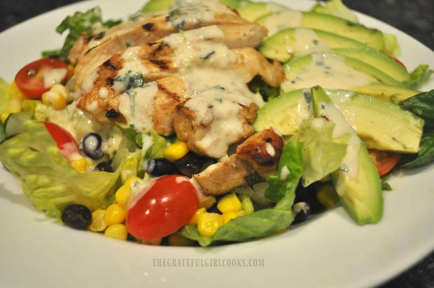 A close up view of this delicious salad, with grilled chicken and avocados.