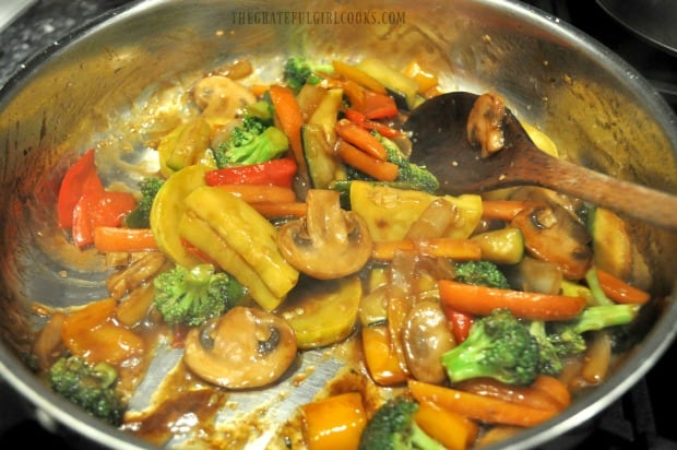 Chopped veggies stir frying with sauce