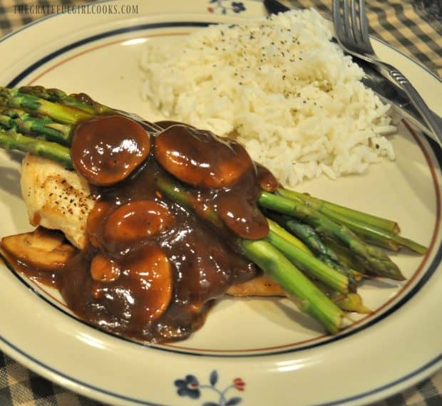 Balsamic Chicken, asparagus and mushrooms in sauce with rice, on plate