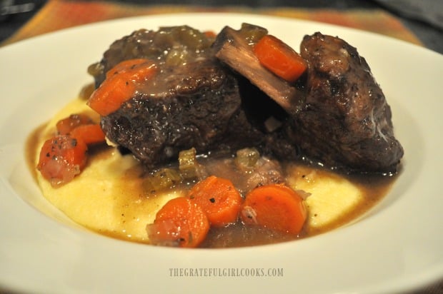 Close up of ribs and polenta with sauce