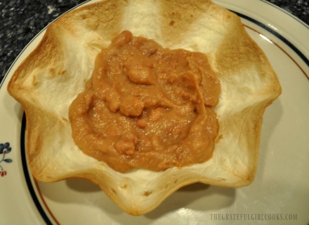 Refried beans in tortilla bowl