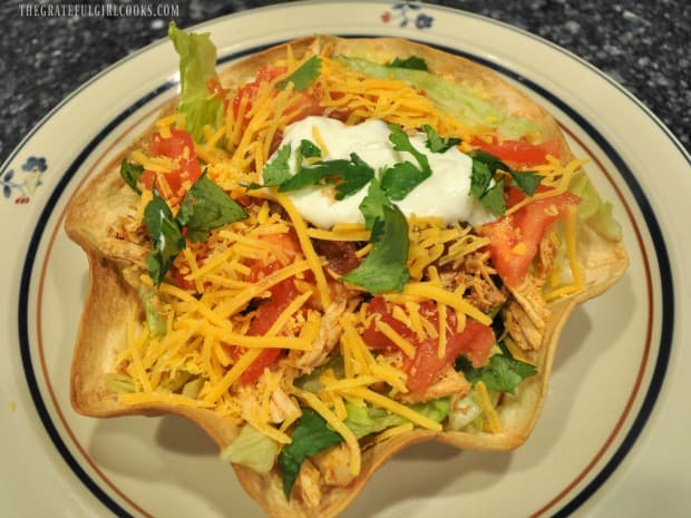 Chicken taco salad in tortilla bowl with cilantro