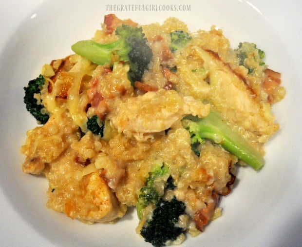 Hot serving of quinoa chicken casserole in white bowl