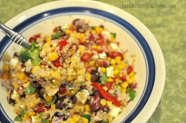 Spoonful of salad over bowl