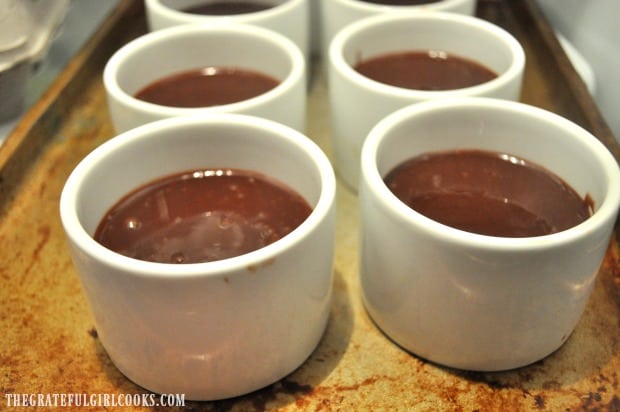 Pots of chocolate chilling in refrigerator