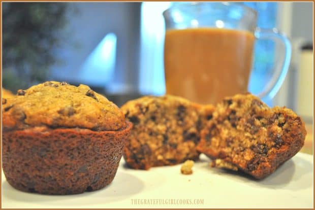 Inside look at banana espresso chocolate chip muffin with coffee behind it