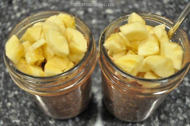 Chopped bananas in jars with chocolate oats