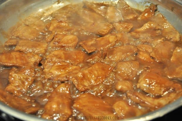 Hoisin pork cooking in large skillet