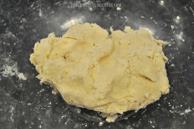 Scone dough, in a ball in glass mixing bowl