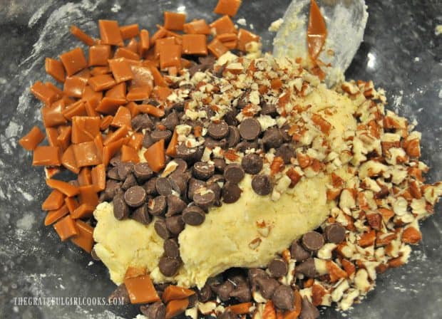 Chocolate chips, caramel pieces and pecans added to scone dough