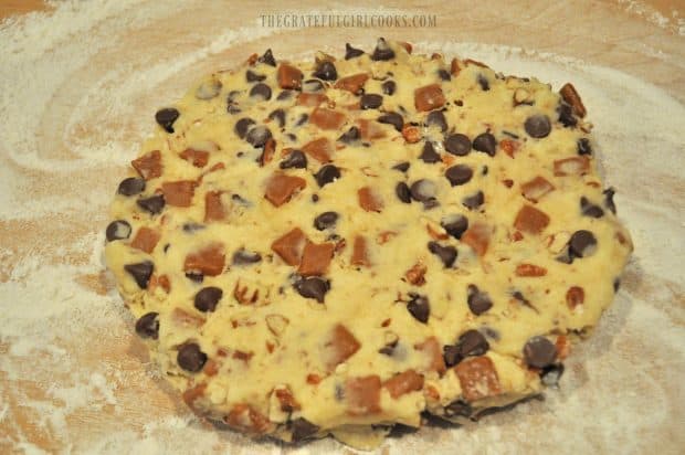 Scone dough is shaped into a circle on floured surface