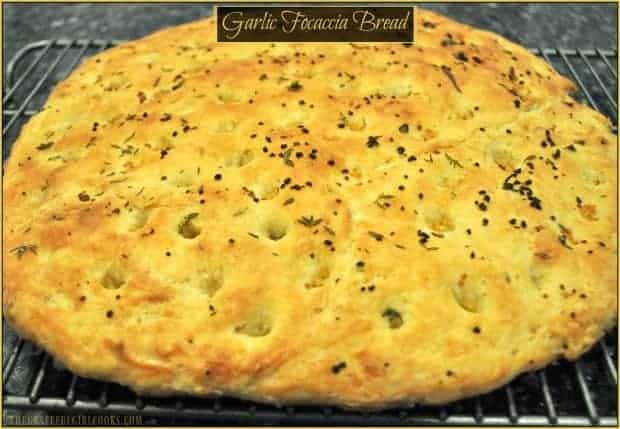 Garlic Focaccia Bread, with olive oil and fresh herbs, is a great side dish for a variety of meats and salads, can be served as an appetizer with dipping oil and herbs, or simply used to make sandwiches!