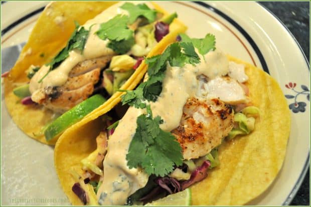 Grilled Fish Tacos with Baja Sauce / The Grateful Girl Cooks! Grilled fish in tortilla with Baja sauce, slaw and cilantro, on plate