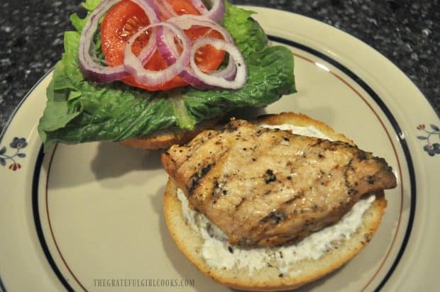 Mediterranean sauce, with chicken, lettuce, tomatoes & onion on sandwich bun