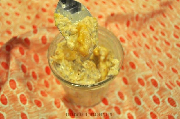 A spoonful of peach cobbler overnight oats ready to eat!