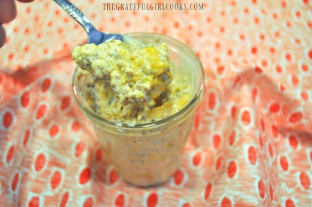 Cold and creamy peach flavored overnight oats are ready to eat!