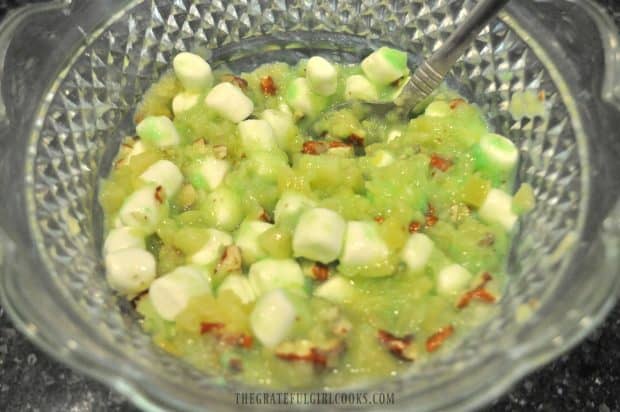 Ingredients stirred together for fluff salad in glass bowl