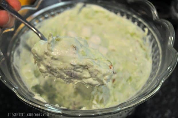 A big spoonful of pistachio pineapple fluff salad, ready to eat!