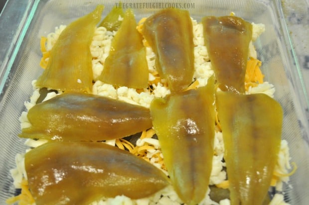 Layers of green chiles and grated cheese for relleno casserole
