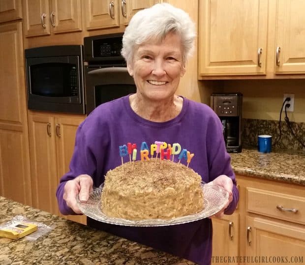 My mom, holding her birthday German Chocolate Cake