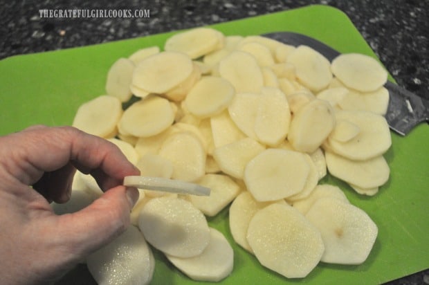 Potatoes are sliced very thin for au gratin dish