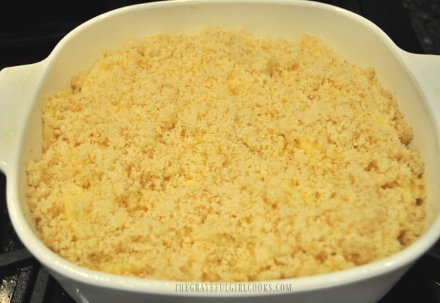 Buttered bread crumbs top potatoes in dish