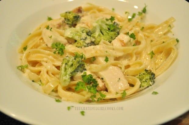 Chicken broccoli fettucine, served in a white bowl 