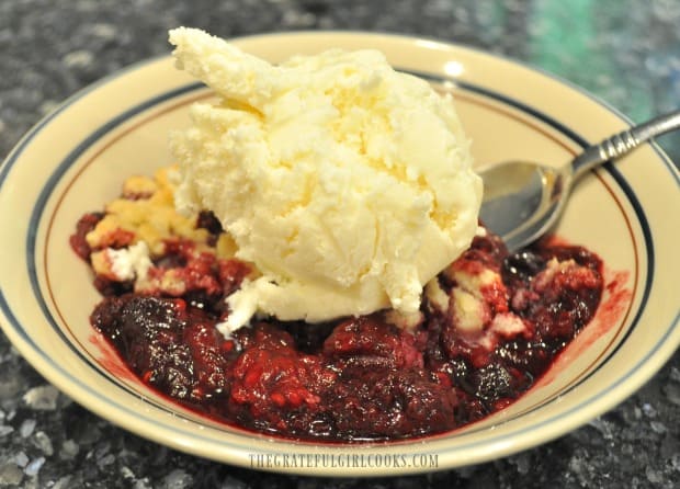Berry Cobbler Trager grill style, served with a scoop of homemade vanilla ice cream!