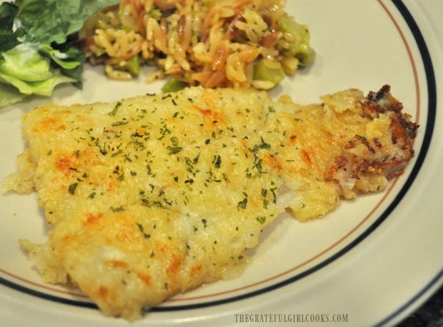 Parmesan crust baked cod served with salad and rice pilaf
