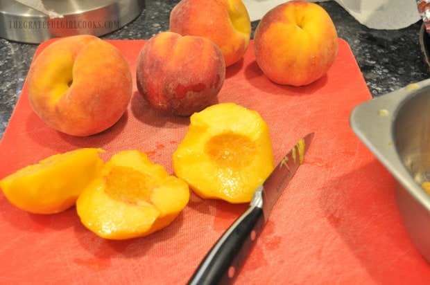 Fresh peaches being sliced for grilled ham salad.