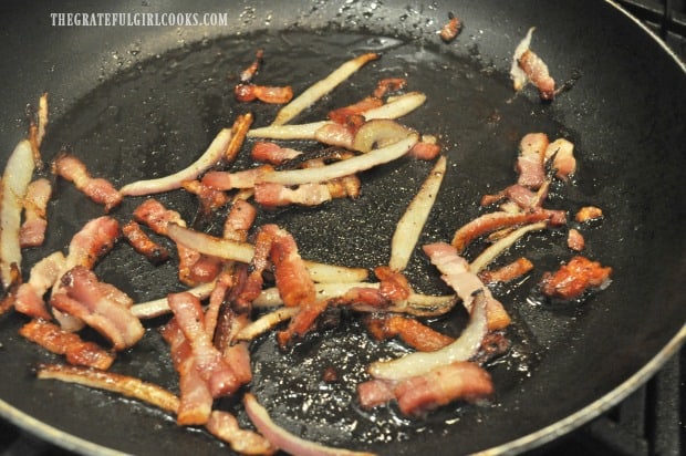 Bacon is cooked until crispy and some fat is rendered.