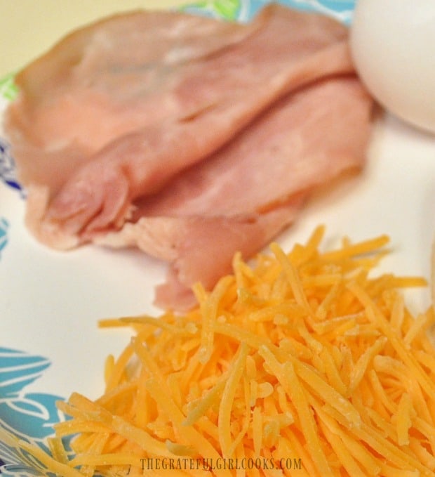 Deli ham and grated cheddar to add to egg mixture for omelet