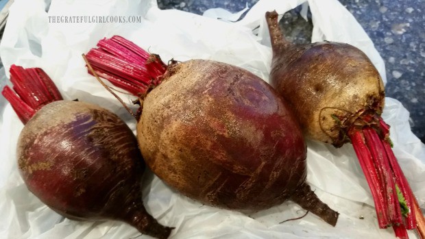 Beets are rinsed and trimmed before oven roasting.