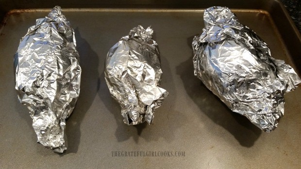 Beets are individually wrapped in foil before oven roasting.