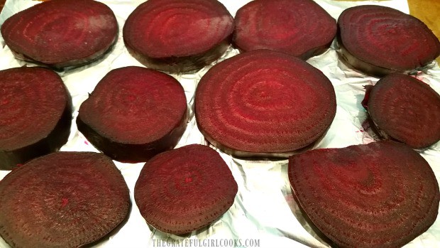 Once cooled, oven roasted beets are sliced thinly before serving.