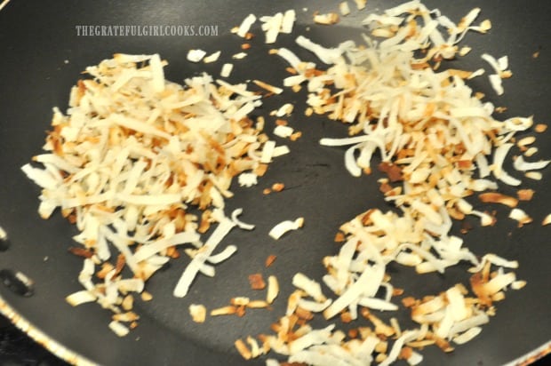 Shredded coconut is toasted for garnish for braised chicken