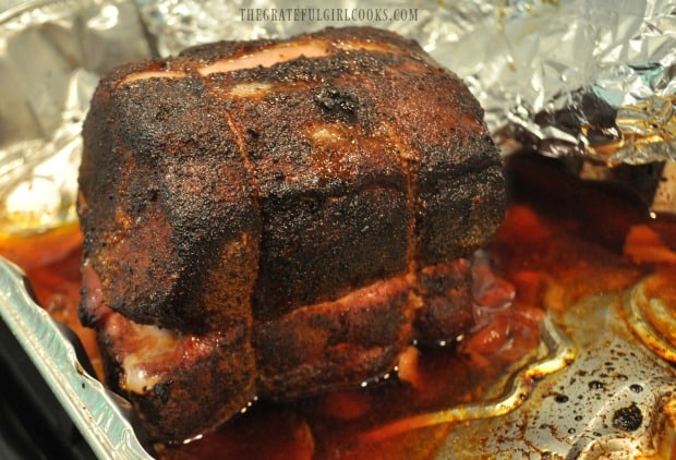 Pork loin roast with dry rub spice mix, after roasting on grill 