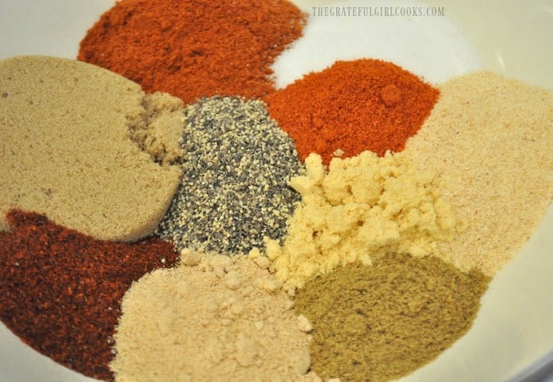 Spices used to make dry rub spice mix measured into bowl before mixing.