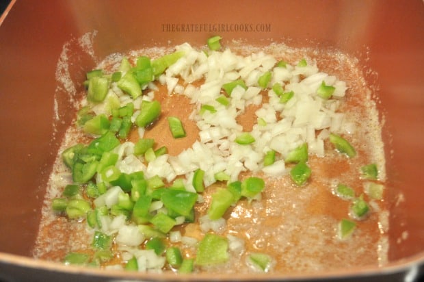 Cooking onions and peppers in butter for chowder.