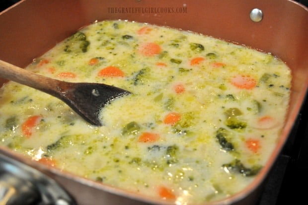 After slurry is added to vegetable soup, it cooks until the broth thickens.