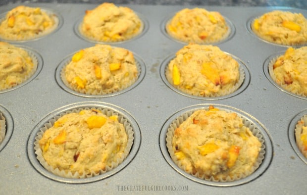 Baked peach jam muffins, hot out of oven.