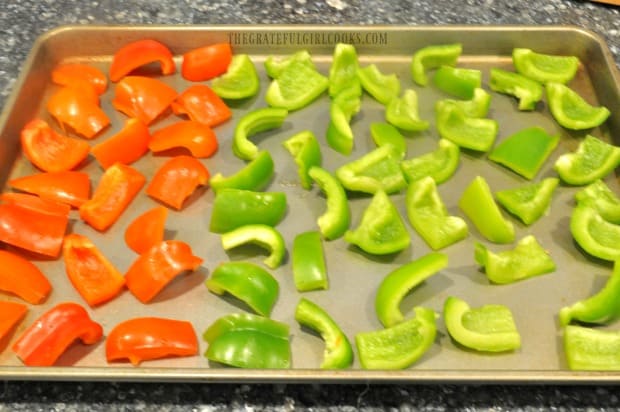 Bell peppers are cut into pieces, then placed in single layer on cookie sheet for freezing.