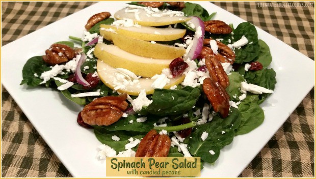 You're gonna LOVE this easy and quick Spinach Pear Salad, with candied pecans, goat cheese and dried cranberries, drizzled with homemade citrus salad dressing!